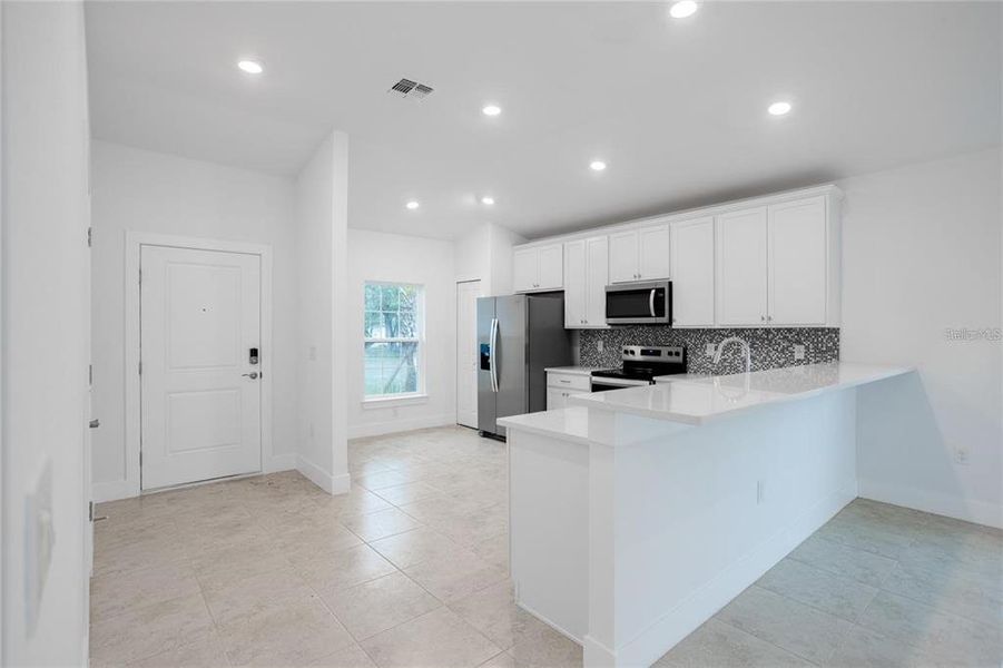 Furnished interior view inside a new home in , Port Charlotte (Image 6). Furnished interior view inside a new home in , Port Charlotte (Image 6).