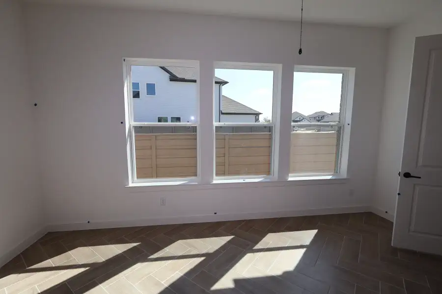 Spacious, unfurnished interior of a new home in Pomona - Grove Row Collection, Manvel (Image 9).