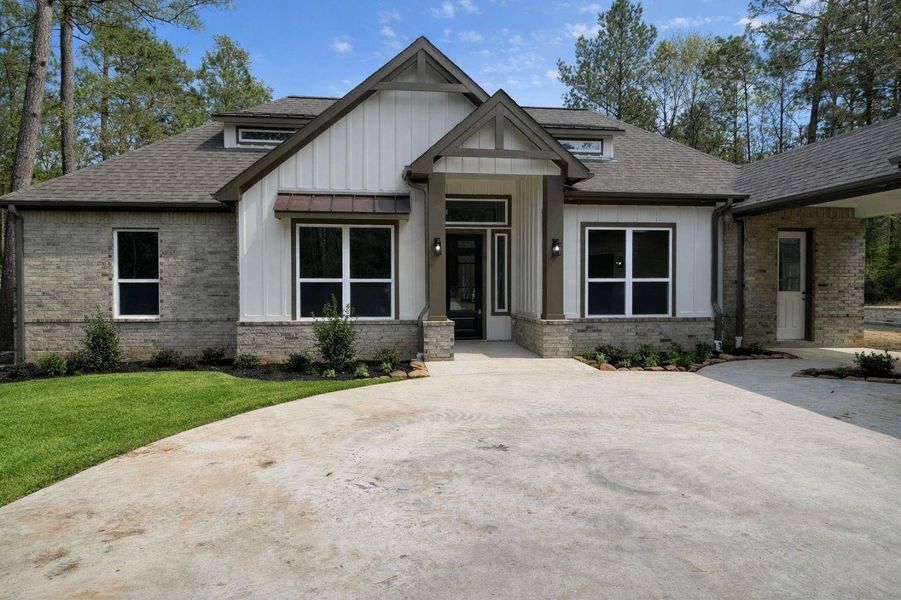 Front exterior of a new home in , Huntsville, TX, highlighting curb appeal (Image 28).