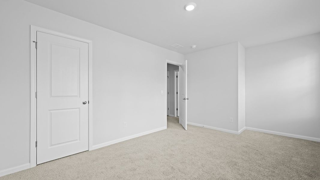 Representative unfurnished interior of a home built from the MURRAY TH by D.R. Horton in Pine Hills Townhomes at Cane Bay, Summerville (Image 26).