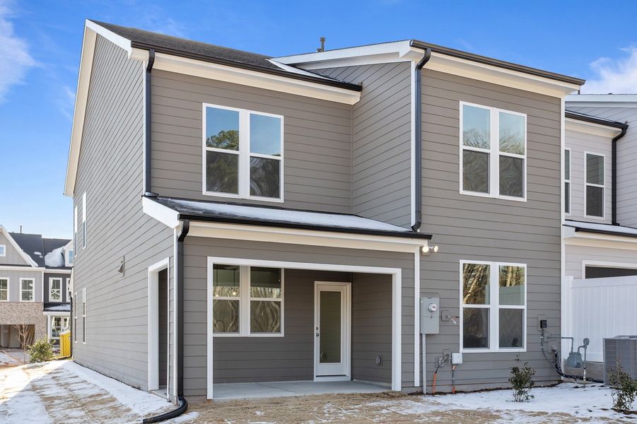 Exterior details and patio area of a home in Ovation at Sweetbrier, Durham (Image 4).
