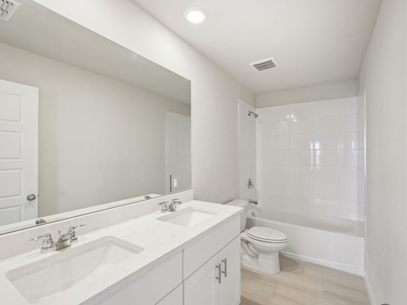 Furnished interior view inside a new home in Crescent Lakes - Premier Series, Punta Gorda (Image 9).