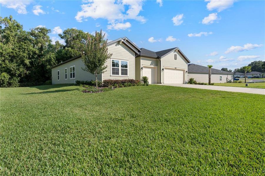 Front exterior of a new home in Grand Park North, Dunnellon, FL, highlighting curb appeal (Image 2).