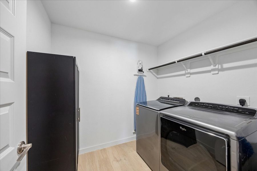 The utility roomis tucked away past the kitchen.  The washer and dryer will stay.