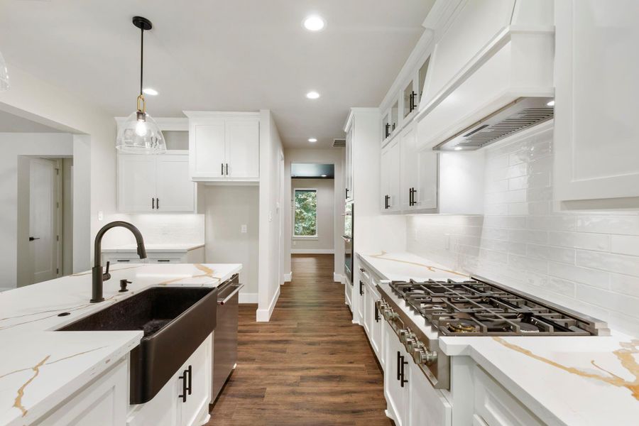 Another view of This modern kitchen. The open layout provides a bright and inviting atmosphere.