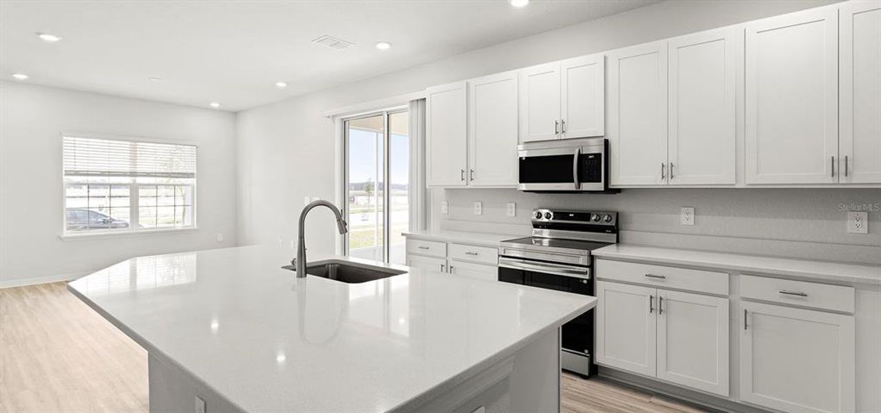 Furnished interior view inside a new home in Estates at Hickory Cove - Bungalows, St. Cloud (Image 8).