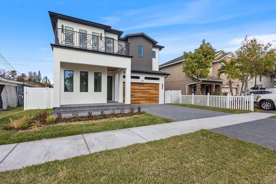 Front exterior of a new home in , Tampa, FL, highlighting curb appeal (Image 25). Front exterior of a new home in , Tampa, FL, highlighting curb appeal (Image 25).