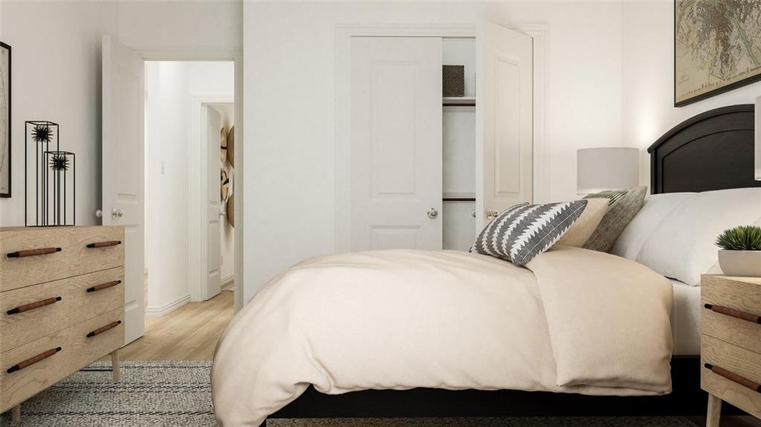 Bedroom featuring light hardwood / wood-style floors and a closet