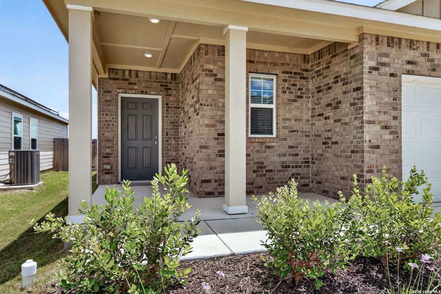 Exterior details and patio area of a home in Hennersby Hollow, San Antonio (Image 18).