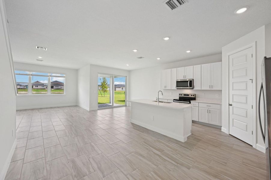 Furnished interior view inside a new home in Brystol at Wylder - Reserve Series, Port St. Lucie (Image 5).