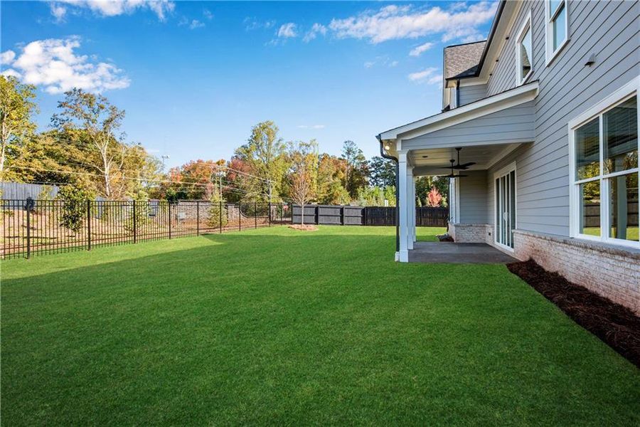 Exterior details and patio area of a home in The Retreat at Caney Creek, Alpharetta (Image 30).