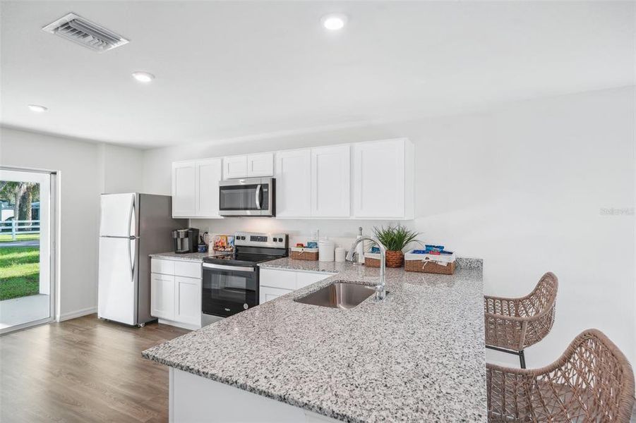 Furnished interior view inside a new home in Eagle Hammock, Eagle Lake (Image 10).