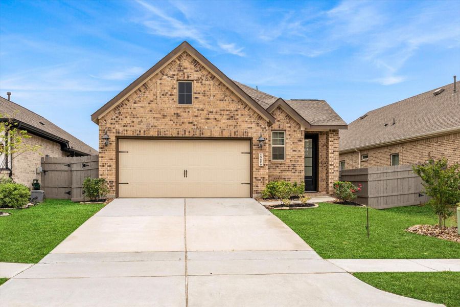Front exterior of a new home in , Conroe, TX, highlighting curb appeal (Image 22). Front exterior of a new home in , Conroe, TX, highlighting curb appeal (Image 22).
