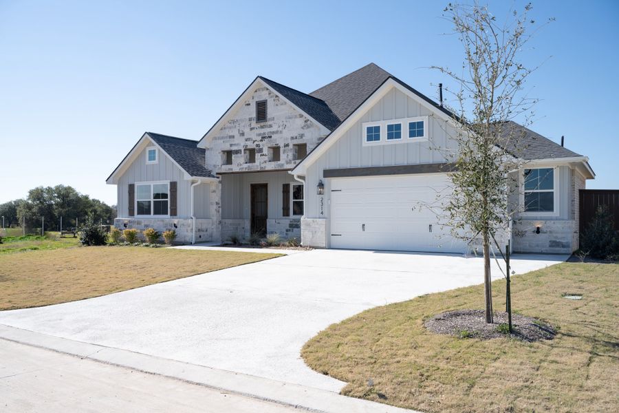 Representative exterior photo of a completed home built from the The Addison by Reece Homes in Greens Prairie Reserve, College Station, TX (Image 12). Representative exterior photo of a completed home built from the The Addison by Reece Homes in Greens Prairie Reserve, College Station, TX (Image 12).