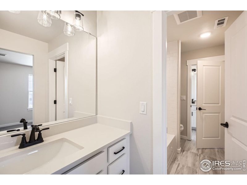 Furnished interior view inside a new home in RainDance National 60/70, Windsor (Image 8).