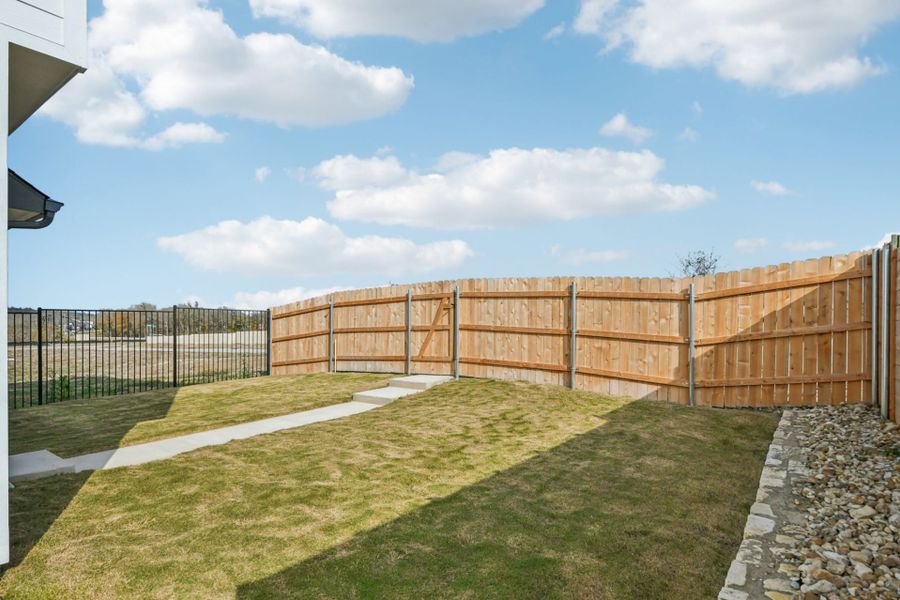 Exterior details and patio area of a home in Whisper Valley, Manor (Image 4).