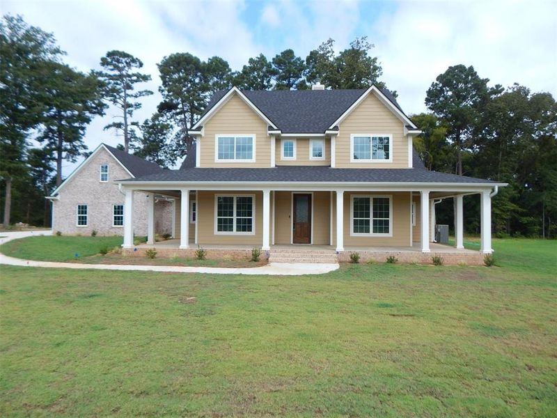 Front exterior of a new home in , Gilmer, TX, highlighting curb appeal (Image 24). Front exterior of a new home in , Gilmer, TX, highlighting curb appeal (Image 24).