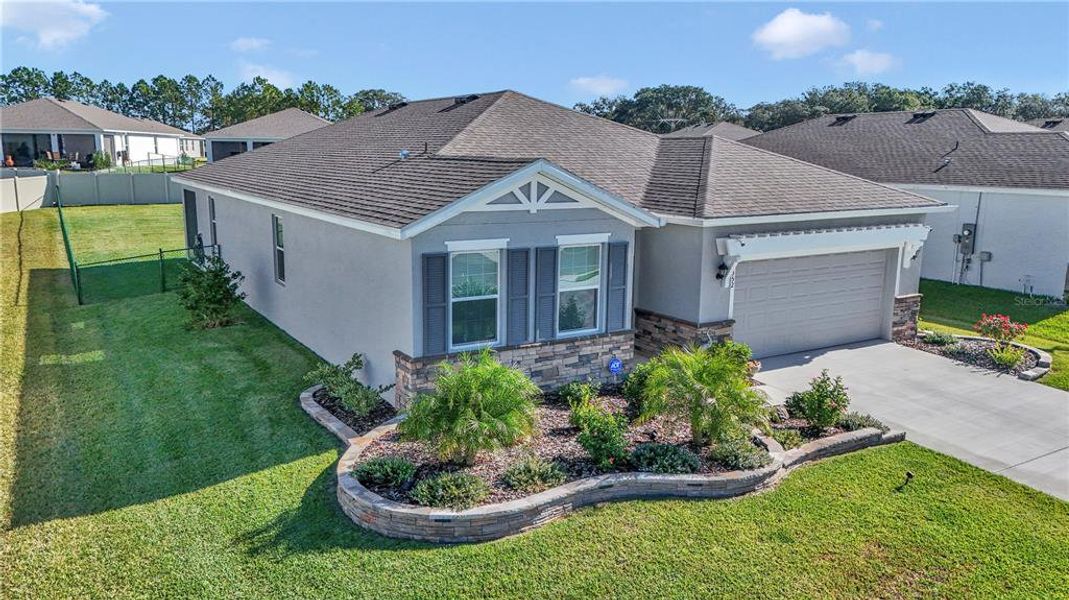 Front exterior of a new home in JB Ranch, Ocala, FL, highlighting curb appeal (Image 20). Front exterior of a new home in JB Ranch, Ocala, FL, highlighting curb appeal (Image 20).