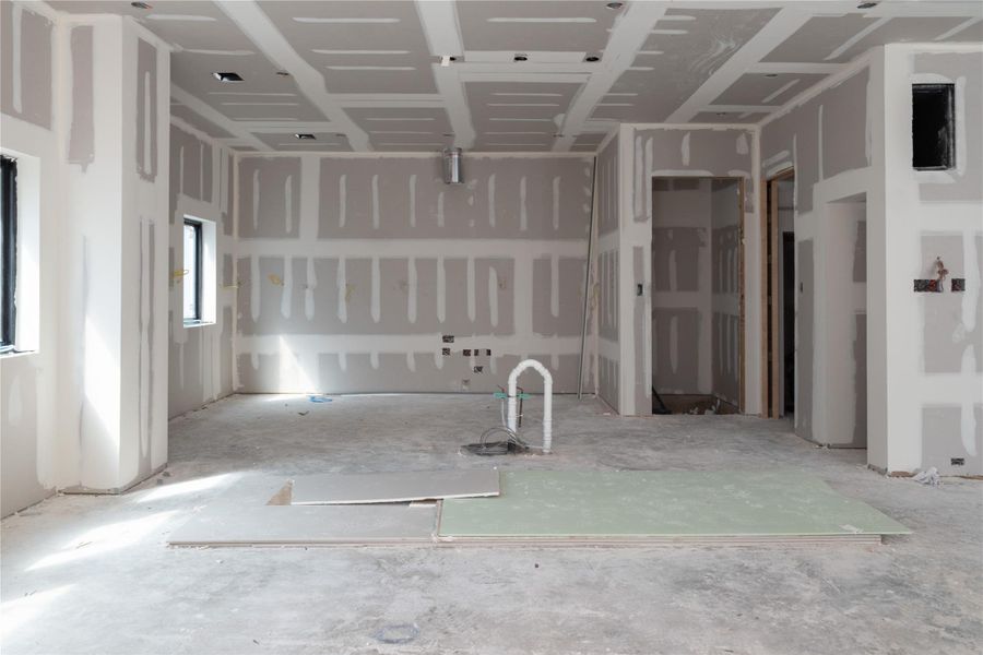 View from the sliding glass doors of the covered patio on Unit B/C looking through the dining room to the kitchen.