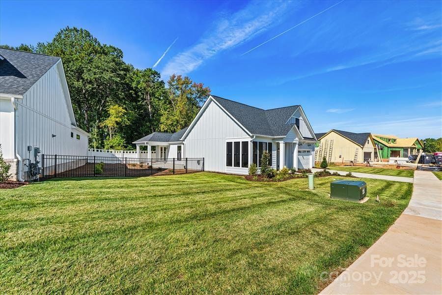 Exterior details and patio area of a home in The Courtyards at Lake Davidson, Mooresville (Image 24).