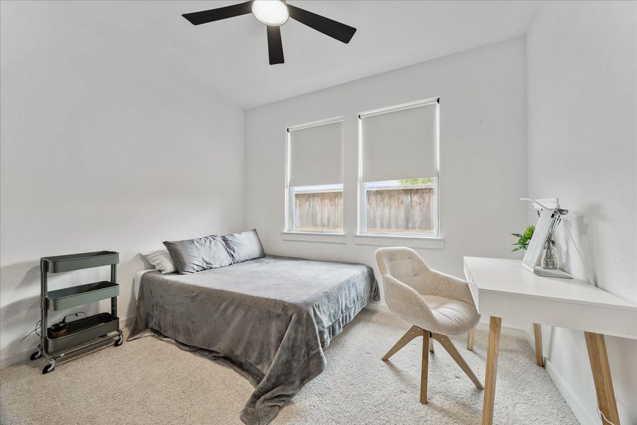 Flexible guest room setup allows for work-from-home functionality, study space, or multigenerational living needs.
