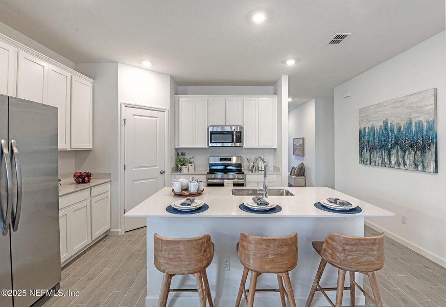Furnished interior view inside a new home in Edenbrooke at Hyland Trail | 55+: Edenbrooke at Hyland Trail 50s, Green Cove Springs (Image 5).
