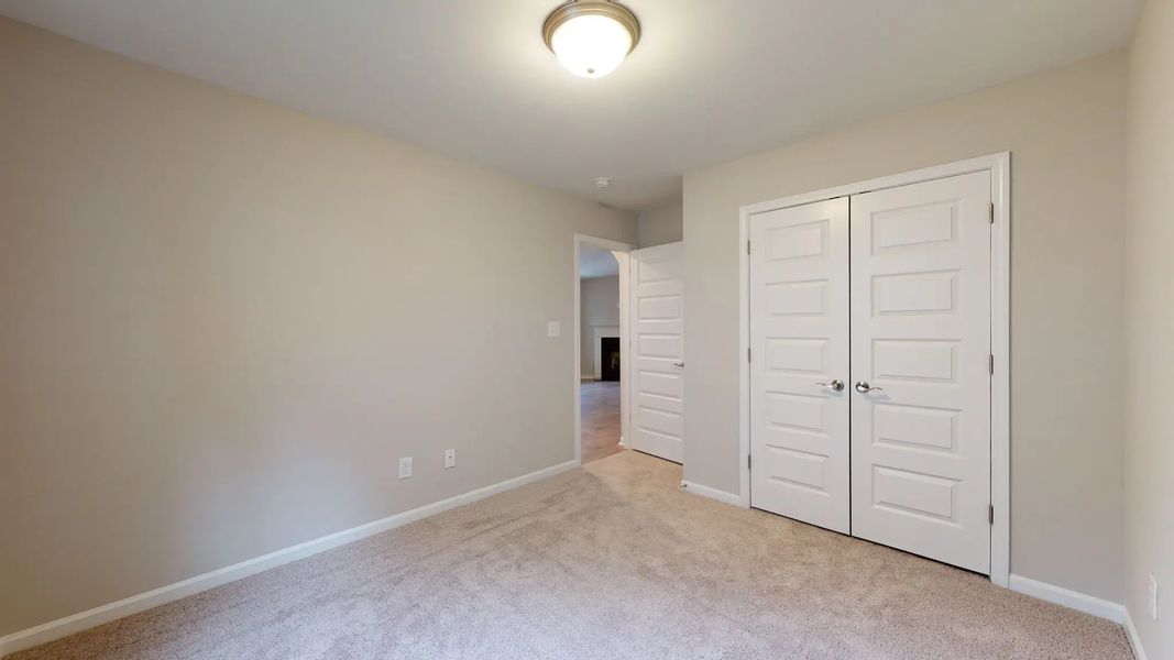 Representative unfurnished interior of a home built from the Kids 2 Car by JC Jackson Homes,LLC in Heritage Pointe, Newport (Image 13).