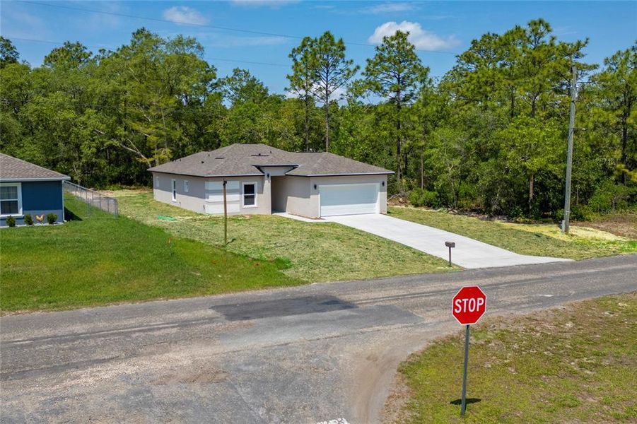 Front exterior of a new home in , Citrus Springs, FL, highlighting curb appeal (Image 16). Front exterior of a new home in , Citrus Springs, FL, highlighting curb appeal (Image 16).