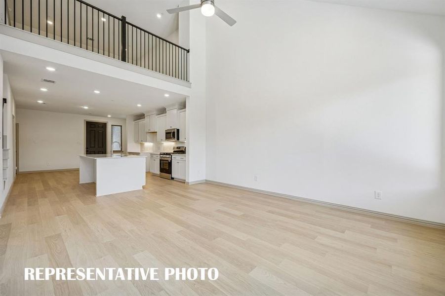 With the family room open to the game room, you'll enjoy a multi level entertainment zone in this fantastic floor plan.  REPRESENTATIVE PHOTO