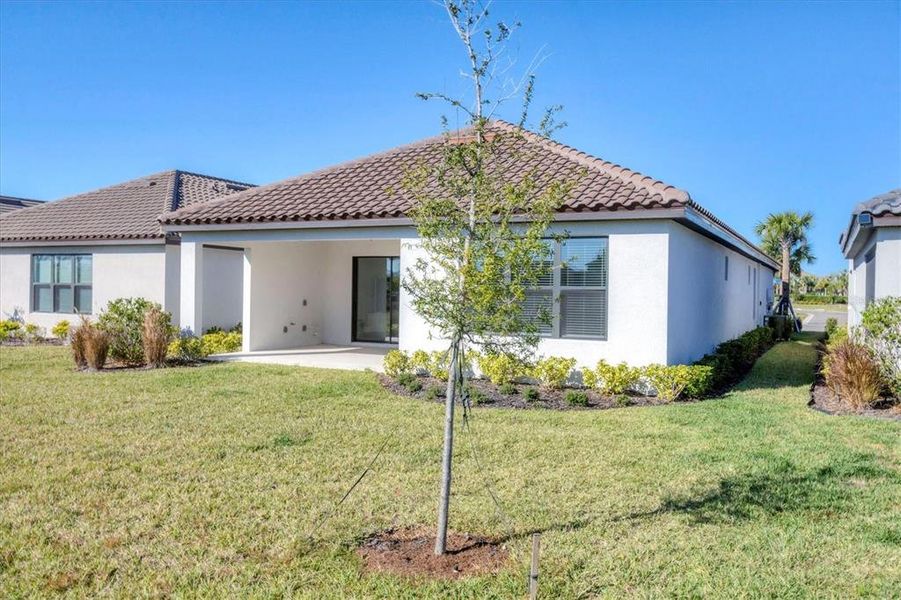 Exterior details and patio area of a home in Esplanade at Artisan Lakes, Palmetto (Image 21).
