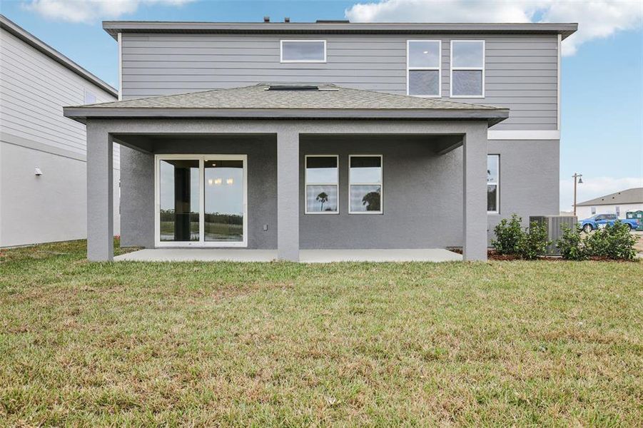 Exterior details and patio area of a home in Oakfield Trails, Parrish (Image 16).