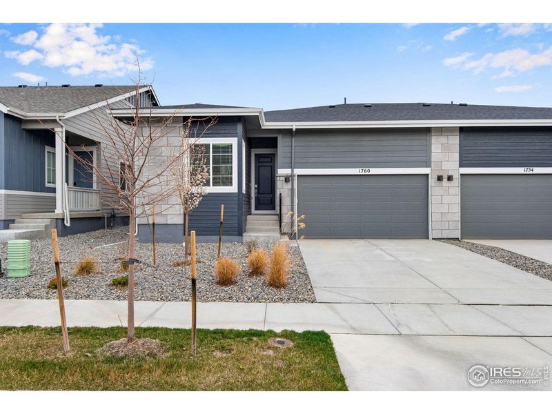 Front exterior of a new home in Westside Crossing, Berthoud, CO, highlighting curb appeal (Image 23).