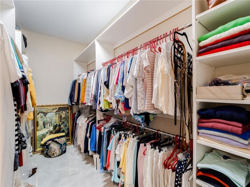 Primary bedroom walk in closet 2