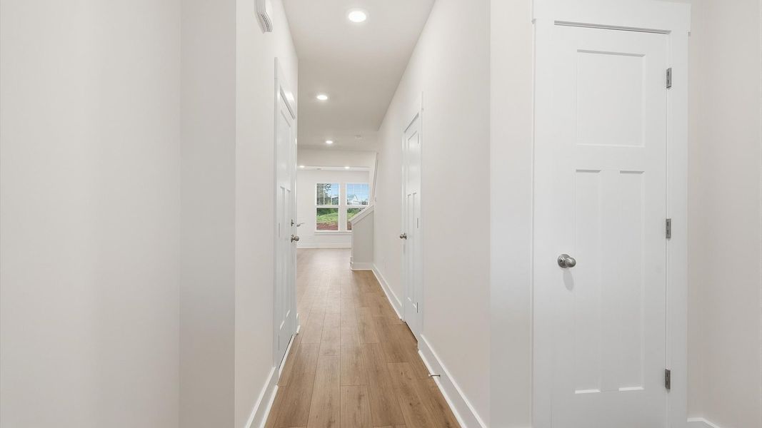 Highly functional foyer with hardwood flooring that flows seamlessly into living spaces at Aspen Ridge