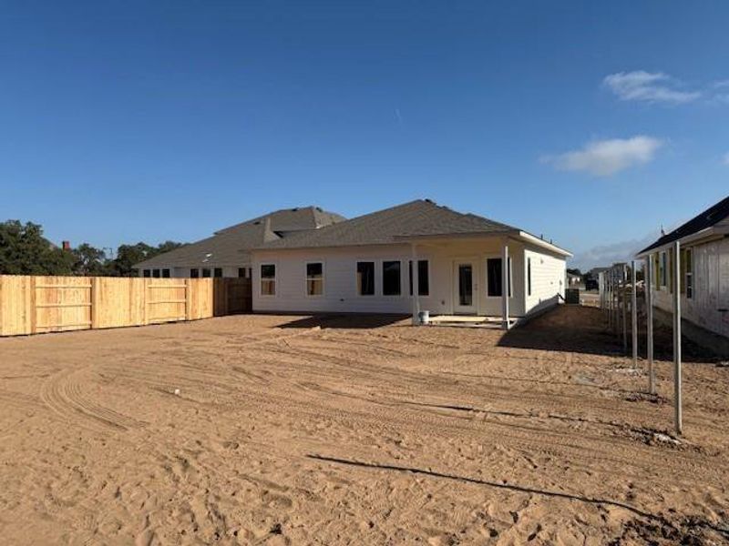 Rear view of property with a patio area and a fenced backyard Rear view of property with a patio area and a fenced backyard