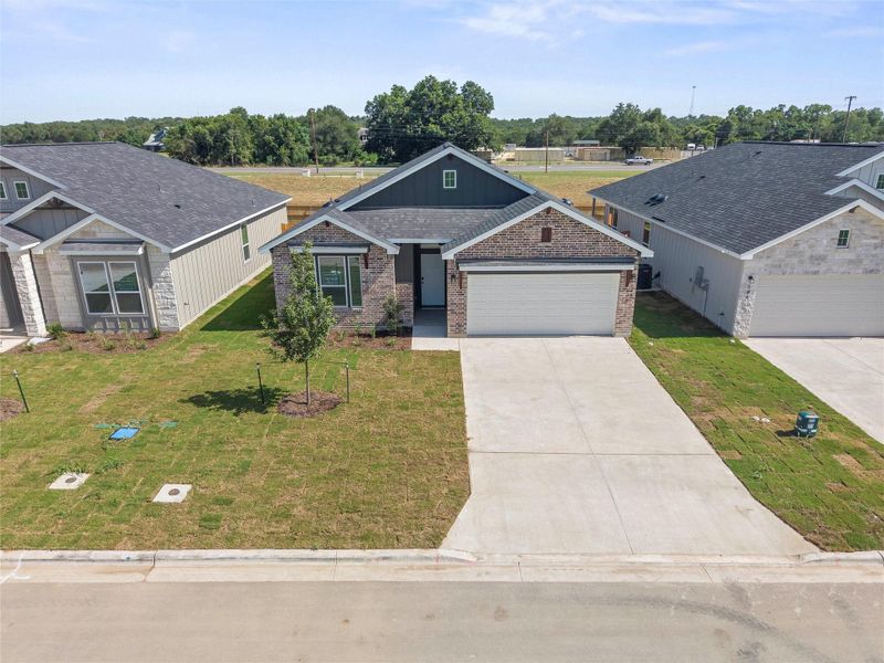 Front exterior of a new home in Rancho San Gabriel, Georgetown, TX, highlighting curb appeal (Image 17).