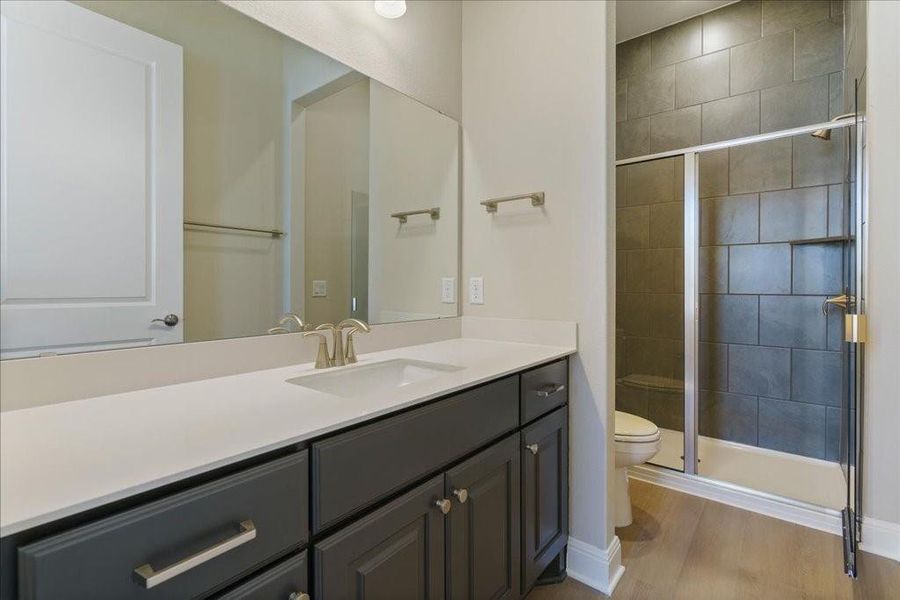 This serene en suite offers a walk-in shower.