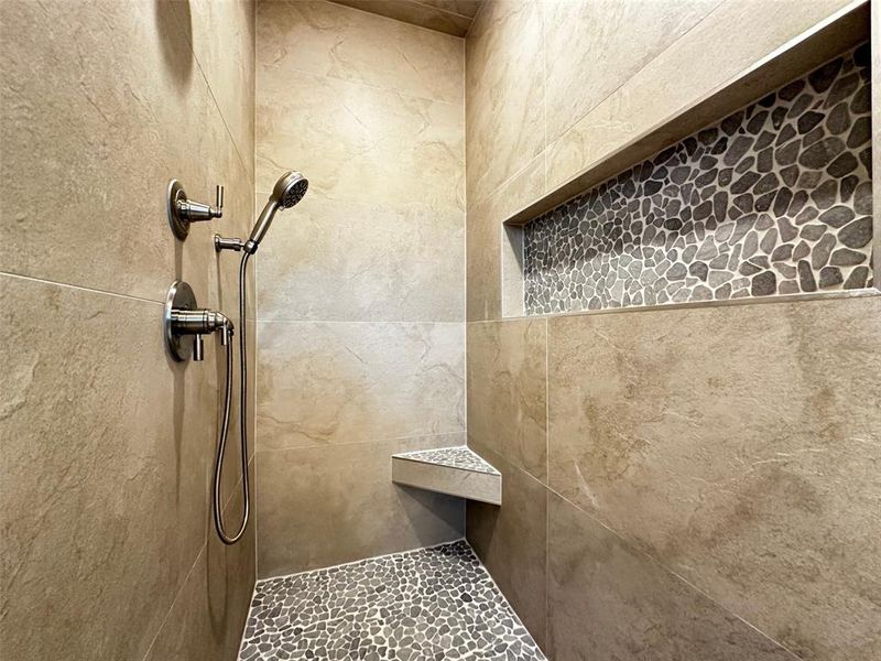 Bathroom featuring tiled shower