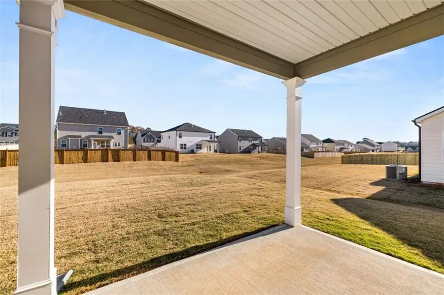 Exterior details and patio area of a home in Preserve at Dove Creek, Statham (Image 3).