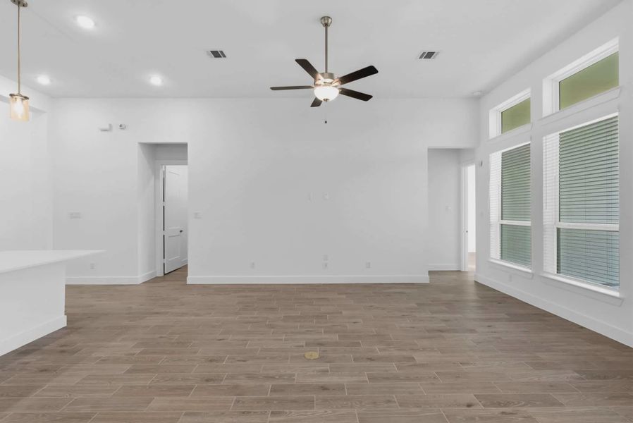 Representative unfurnished interior of a home built from the Summerton by Chesmar Homes in Beacon Point, Texas City (Image 23).
