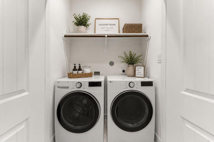 Dedicated laundry space conveniently located with additional storage potential.