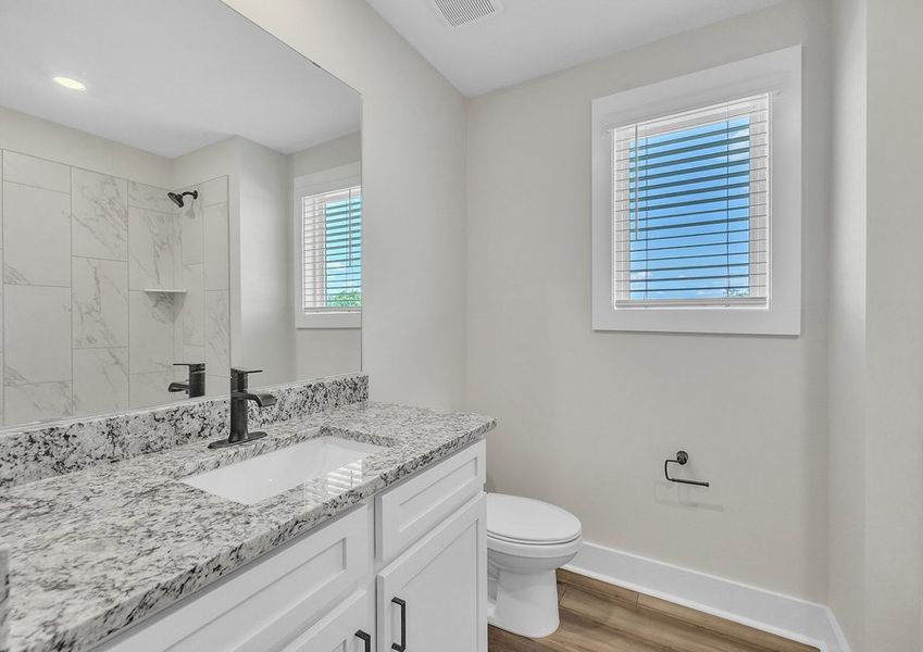 The secondary bathroom has a large soaking tub.