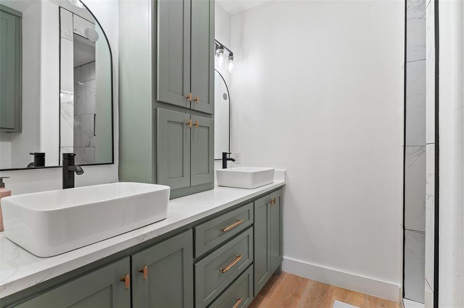 Bathroom featuring hardwood / wood-style floors and vanity