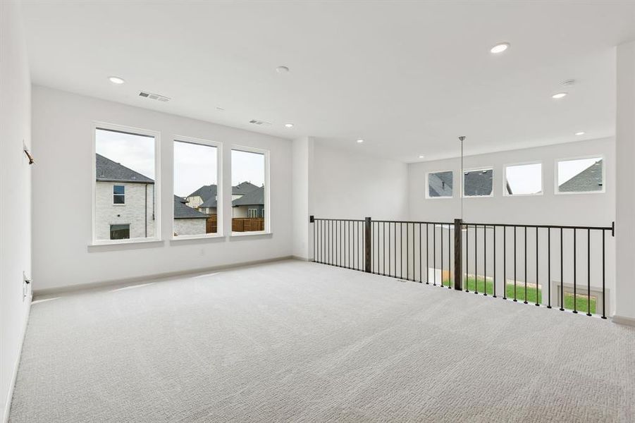 Bright and spacious, this oversized game room is the perfect place to host family game night or those big game day parties!