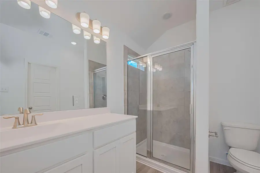 Furnished interior view inside a new home in Sunterra, Katy (Image 11).