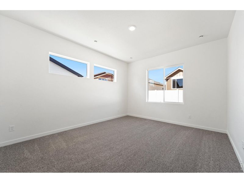 Spacious, unfurnished interior of a new home in Union Colony West, Greeley (Image 14).