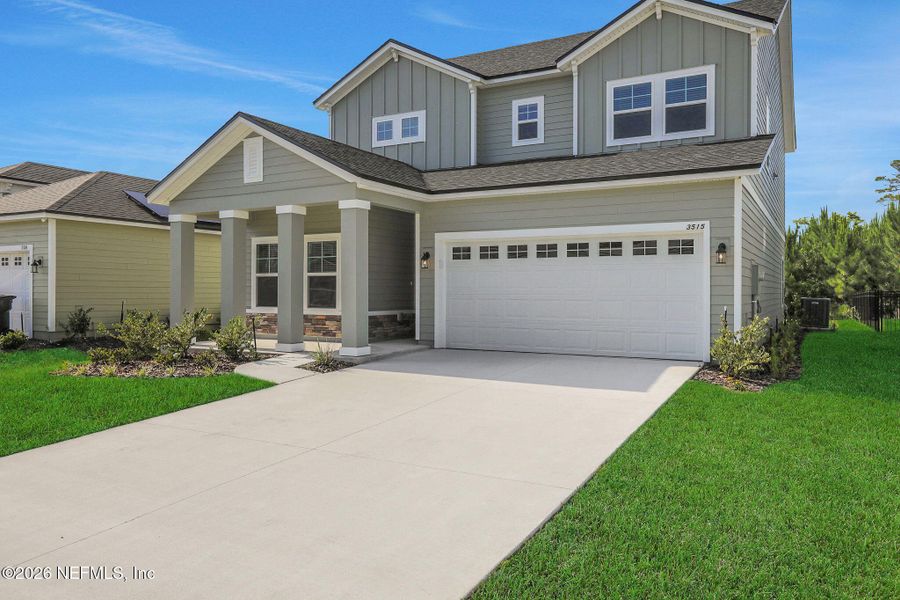 Front exterior of a new home in Hyland Trail, Green Cove Springs, FL, highlighting curb appeal (Image 27).