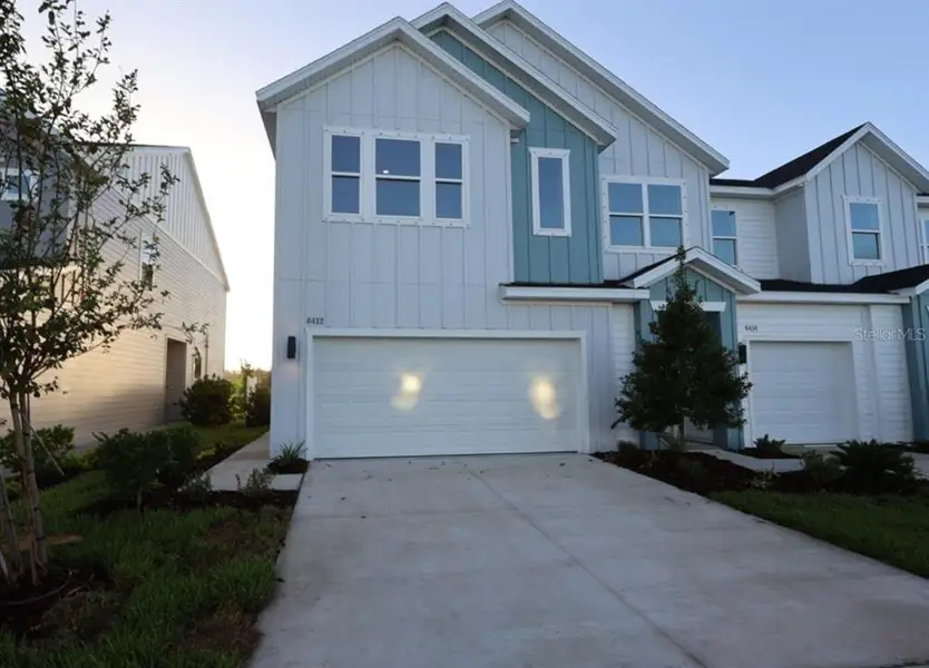 Front exterior of a new home in , Apollo Beach, FL, highlighting curb appeal (Image 2). Front exterior of a new home in , Apollo Beach, FL, highlighting curb appeal (Image 2).