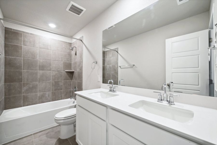 Guest bathroom in the Reynolds floorplan at a Meritage Homes community.