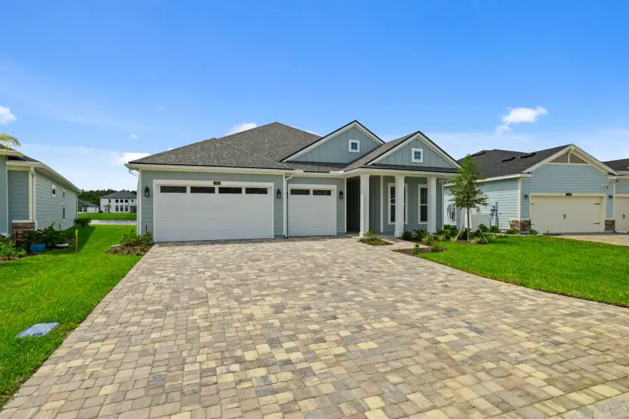 Representative exterior photo of a completed home built from the Aurora by Riverside Homes in Sagebrush at EverRange, Jacksonville, FL (Image 30).